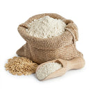 Bulk oats flour in burlap sack with raw oat grains and wooden scoop on white background