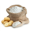 Burlap sack filled with potato starch, wooden scoop, and raw whole and sliced potatoes